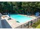 Enjoy the community's sparkling pool with lounge chairs and umbrellas for relaxation and fun at 2365 Barrington Trace Sw Cir, Atlanta, GA 30331