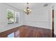 Elegant dining room features hardwood floors, chandelier, and wainscoting, perfect for hosting at 2365 Barrington Trace Sw Cir, Atlanta, GA 30331
