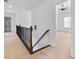 Hallway with wooden handrail leading to bedroom at 2365 Barrington Trace Sw Cir, Atlanta, GA 30331