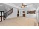 Open living room featuring a staircase and view to the kitchen with stainless appliances at 2365 Barrington Trace Sw Cir, Atlanta, GA 30331