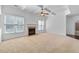 Bright living room with fireplace, ceiling fan, and large windows at 2365 Barrington Trace Sw Cir, Atlanta, GA 30331