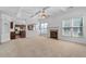Spacious living room features a fireplace, ceiling fan, and lots of natural light at 2365 Barrington Trace Sw Cir, Atlanta, GA 30331