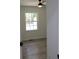 Bedroom with a large window providing natural light and a modern ceiling fan at 3811 Crosby Nw Dr, Atlanta, GA 30331