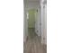 Hallway leading to a bedroom with modern flooring and white doors at 3811 Crosby Nw Dr, Atlanta, GA 30331