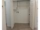 Laundry room with bi-fold doors, storage cabinets and shelves at 3811 Crosby Nw Dr, Atlanta, GA 30331