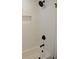 Modern shower with white subway tiles, matte black fixtures, and built-in niche at 3811 Crosby Nw Dr, Atlanta, GA 30331