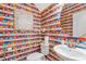 Whimsical powder room with colorful, quirky wallpaper and unique decor at 417 Brooch Way, Stockbridge, GA 30281
