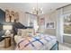 Inviting bedroom with a vibrant skateboard theme, modern lighting, and plenty of natural light at 417 Brooch Way, Stockbridge, GA 30281