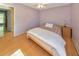 Bedroom featuring hardwood floors, a ceiling fan, a large window, and a neutral color scheme at 951 Woodmont Dr, Marietta, GA 30062