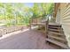 Multi-level wooden deck with stairs leading to the backyard, ideal for enjoying outdoor living at 951 Woodmont Dr, Marietta, GA 30062
