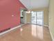 Open dining area with hardwood floors, a sliding glass door, and view of modern kitchen at 951 Woodmont Dr, Marietta, GA 30062