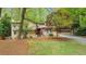 Charming exterior view of a two-story home featuring mixed siding and a well-manicured front lawn at 951 Woodmont Dr, Marietta, GA 30062