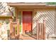 Close-up of a red front door with decorative hardware, stone accents, and well-maintained trim at 951 Woodmont Dr, Marietta, GA 30062