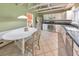 Bright kitchen featuring granite countertops, stainless steel appliances, white cabinetry, and a breakfast area at 951 Woodmont Dr, Marietta, GA 30062