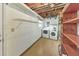 Basement laundry room with a washer, dryer, shelving and overhead lighting at 951 Woodmont Dr, Marietta, GA 30062