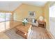 Bright living room with hardwood floors, neutral walls, large windows, and sliding glass door to a deck at 951 Woodmont Dr, Marietta, GA 30062