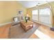 Bright living room with hardwood floors, neutral walls, large windows, and comfortable seating at 951 Woodmont Dr, Marietta, GA 30062