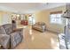 Open living area with hardwood floors, a stone fireplace, and multiple seating options at 951 Woodmont Dr, Marietta, GA 30062