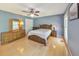 Relaxing main bedroom with hardwood floors, a ceiling fan, ample closet space, and natural light at 951 Woodmont Dr, Marietta, GA 30062