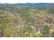 Expansive aerial view of lush forest, showcasing the homes peaceful wooded setting at 18 Crolley Ln, White, GA 30184