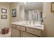 A well-lit bathroom with a vanity, large mirror, and tiled floors at 18 Crolley Ln, White, GA 30184