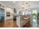 Beautiful kitchen with stone accents, pendant lighting, and stainless steel appliances at 18 Crolley Ln, White, GA 30184