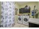 Convenient laundry room with washer, dryer, and ample storage space at 18 Crolley Ln, White, GA 30184