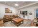 The warm living area is furnished with a plush sofa, a decorative rug, and stylish lighting fixtures at 18 Crolley Ln, White, GA 30184