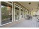 Enjoy the outdoors on the covered porch with plenty of seating and views of the trees at 18 Crolley Ln, White, GA 30184