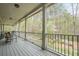 A large covered porch offering plenty of room to unwind with views of the landscaped backyard at 18 Crolley Ln, White, GA 30184