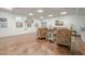 Bright recreation room featuring hardwood floors, wainscoting, coffered ceiling, and ample natural light at 18 Crolley Ln, White, GA 30184
