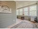 Bright sunroom filled with natural light through many windows overlooking trees at 18 Crolley Ln, White, GA 30184