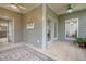 Corner of a sunroom filled with lots of natural light, tile floors, and a ceiling fan at 18 Crolley Ln, White, GA 30184