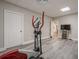 Home gym area with exercise equipment, grey vinyl floors, and a wall-mounted television at 18 Crolley Ln, White, GA 30184