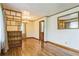 Spacious living room with hardwood floors and built-in shelving at 5295 Woodland Dr, Lake City, GA 30260