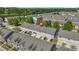 An aerial view of townhomes in a residential neighborhood, showcasing the well-maintained exteriors and community layout at 7691 Cabrini Pl, Fairburn, GA 30213