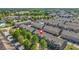 Aerial view of the townhome community nestled amongst mature trees at 7691 Cabrini Pl, Fairburn, GA 30213