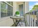 Cozy balcony with a table and chairs, perfect for relaxing outdoors at 7691 Cabrini Pl, Fairburn, GA 30213