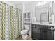 Well-maintained bathroom with a shower-tub combination, vanity, and modern fixtures at 7691 Cabrini Pl, Fairburn, GA 30213