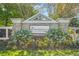 The 'Renaissance at Southpark' community sign, featuring stone accents, landscaping, and inviting entryway at 7691 Cabrini Pl, Fairburn, GA 30213