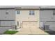 Exterior home view, highlighting garage, siding, and the neatly manicured lawn at 7691 Cabrini Pl, Fairburn, GA 30213
