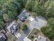 An aerial view shows beautiful homes with well-manicured lawns and landscaping on a cul-de-sac road at 907 Fox Croft Pl, Canton, GA 30114