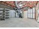 Unfinished basement with exposed utilities, concrete floor, and shelving, ready for customization at 907 Fox Croft Pl, Canton, GA 30114