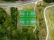 Aerial view of community basketball courts nestled among trees and walking paths at 907 Fox Croft Pl, Canton, GA 30114