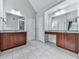 Large bathroom with granite counters, double sinks, and tile floors at 907 Fox Croft Pl, Canton, GA 30114
