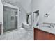Well lit bathroom featuring a glass shower and a separate tub beneath an A-Frame roof at 907 Fox Croft Pl, Canton, GA 30114