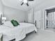 Bedroom features a ceiling fan, carpeted floors, and an ensuite bathroom at 907 Fox Croft Pl, Canton, GA 30114