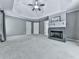 Large bedroom featuring carpet, a fireplace, tray ceiling, and neutral walls at 907 Fox Croft Pl, Canton, GA 30114