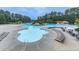 A large community pool with plenty of seating and a water park feature at 907 Fox Croft Pl, Canton, GA 30114