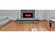 Stone fireplace with hearth and mantel, complemented by hardwood floors and neutral wall color at 907 Fox Croft Pl, Canton, GA 30114
